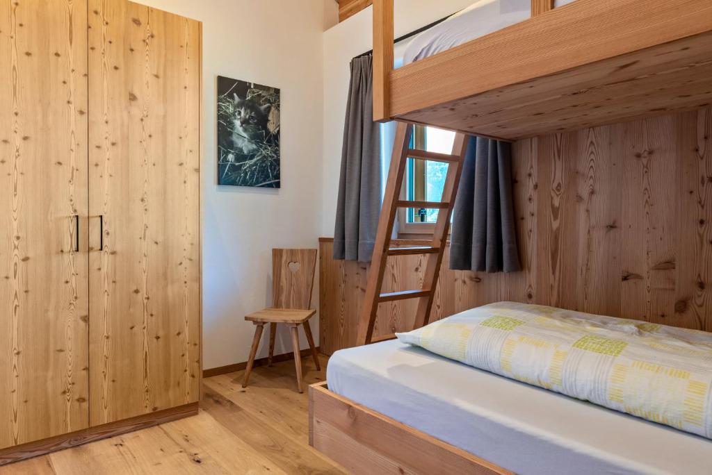 Postel nebo postele na pokoji v ubytování Guntschöllerhof Mendelkamm
