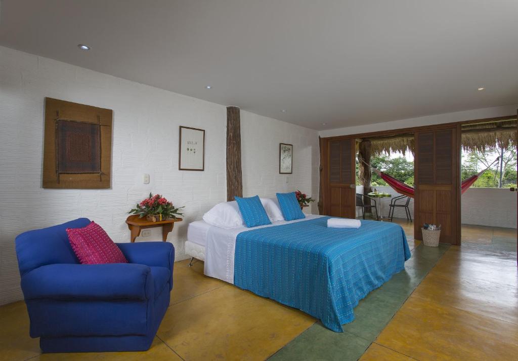 Postel nebo postele na pokoji v ubytování Hotel Cinaruco Caney