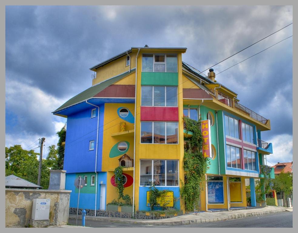 a colorful building on the side of a street at The Colourful Mansion Hotel in Ahtopol