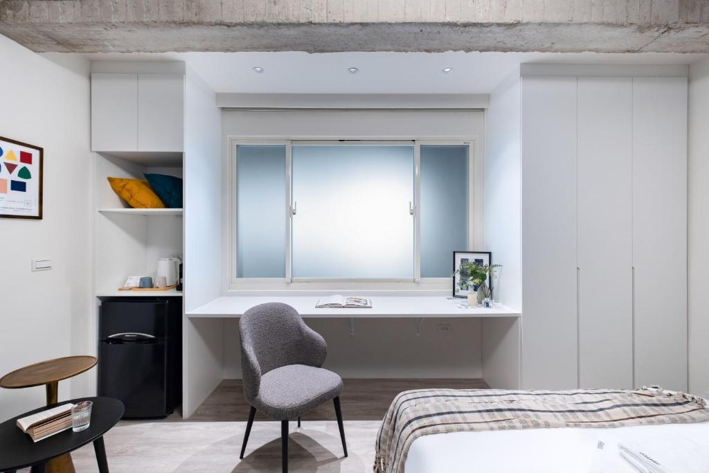 Postel nebo postele na pokoji v ubytování Lin Suites by Olala Homes