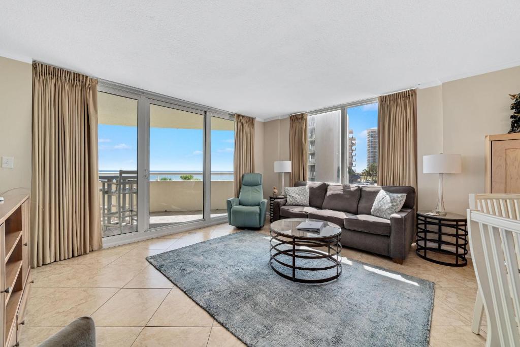 a living room with a couch and a table at Perdido Sun 214 in Perdido Key