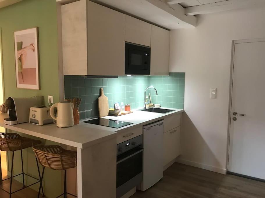 Kuchyňa alebo kuchynka v ubytovaní Appartement Moonrise - Plage 50m - Rue gratuite