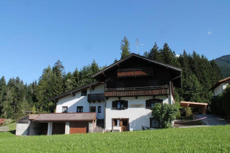 a large white building with a black roof at Haus Gerdi in Söll