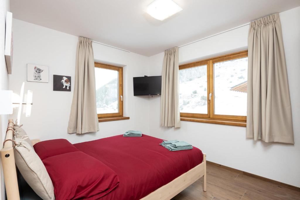 Łóżko lub łóżka w pokoju w obiekcie Pianeta Oro Chalet Allegra