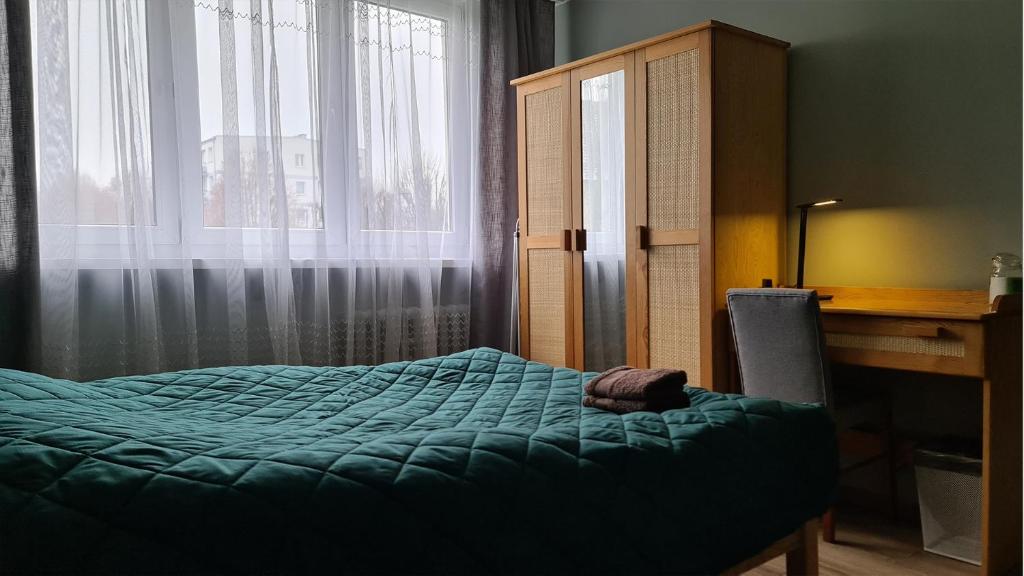 Posteľ alebo postele v izbe v ubytovaní Spokojny Wypoczynek 4