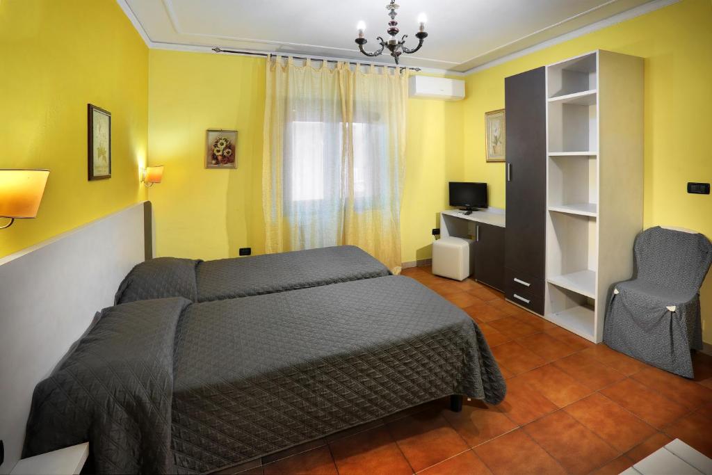 Postel nebo postele na pokoji v ubytování Hotel La Querceta