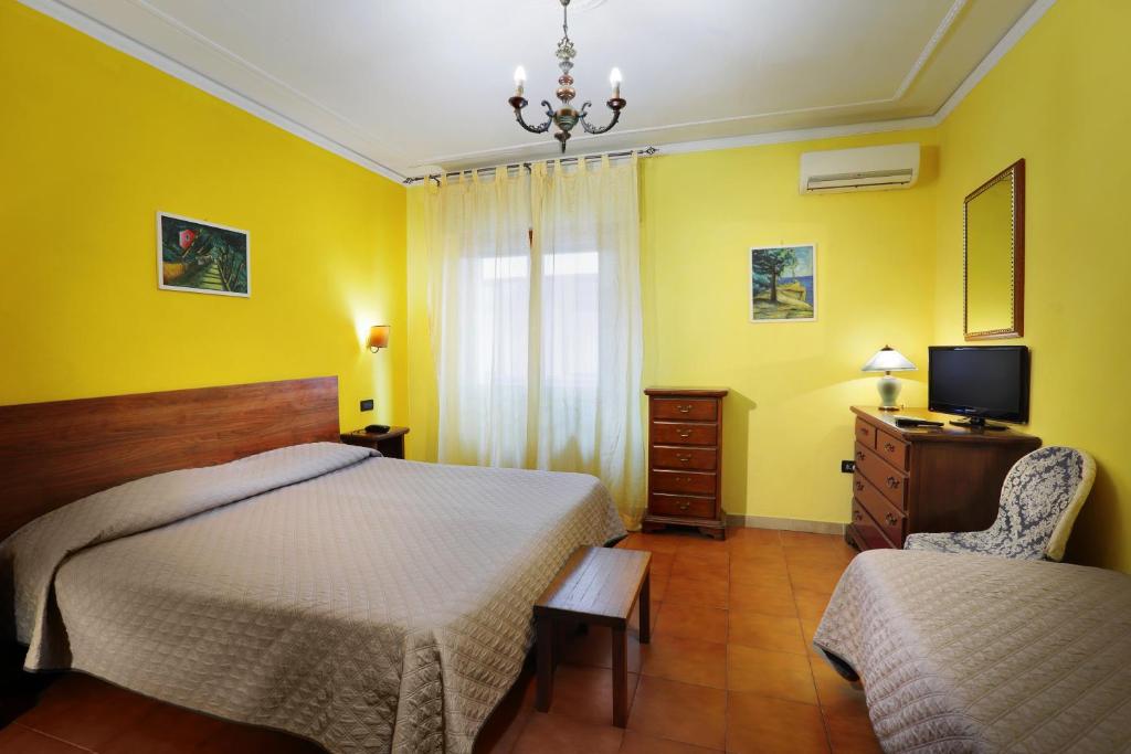 Postel nebo postele na pokoji v ubytování Hotel La Querceta