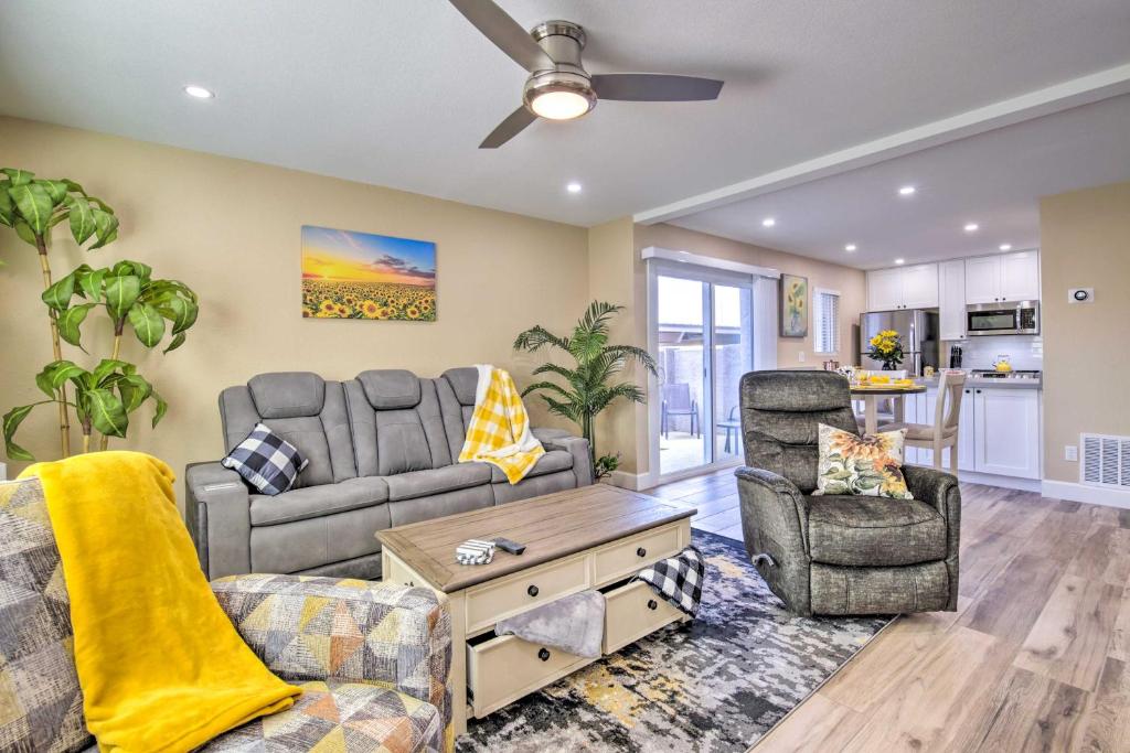a living room with a couch and a chair at Arizona Condo with Community Pool and Hot Tub in Mesa