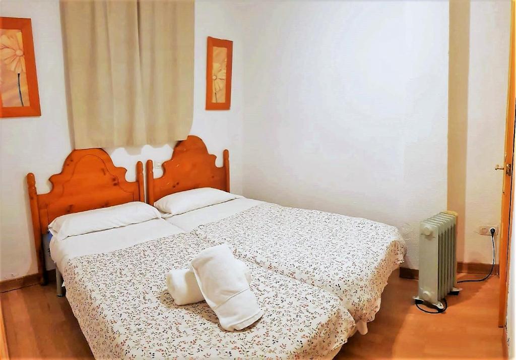 Cama o camas de una habitación en TODOSIERRANEVADA ZONA BAJA - MONTBLANC VISTAS A LA MONTANA - Junto a los Telecabinas