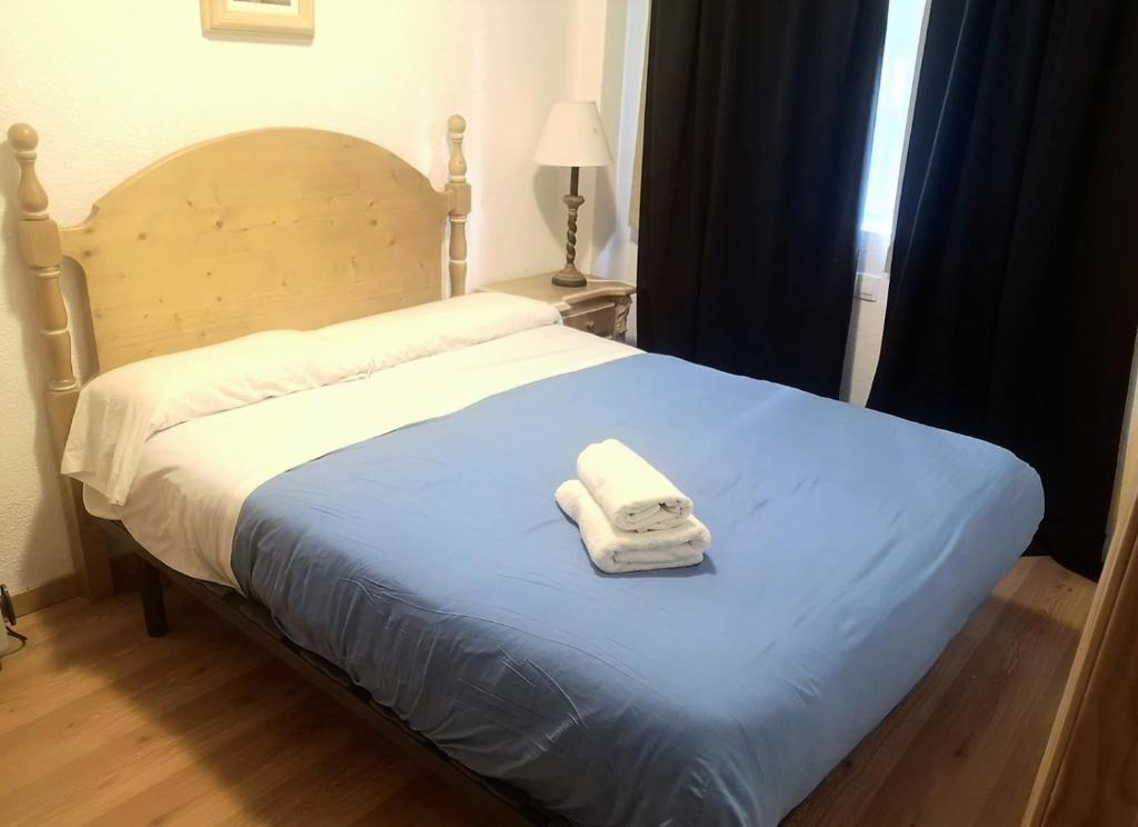 Cama o camas de una habitación en TODOSIERRANEVADA ZONA BAJA - MONTBLANC VISTAS A LA MONTANA - Junto a los Telecabinas