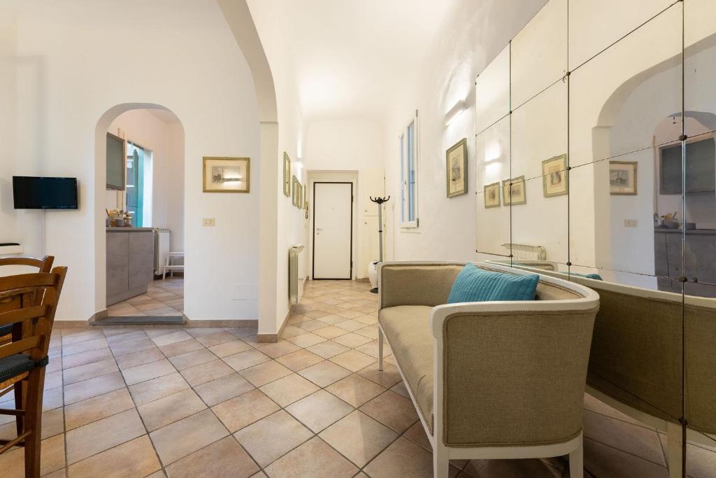 a living room with a couch and a table at Terme Apartment in Florence