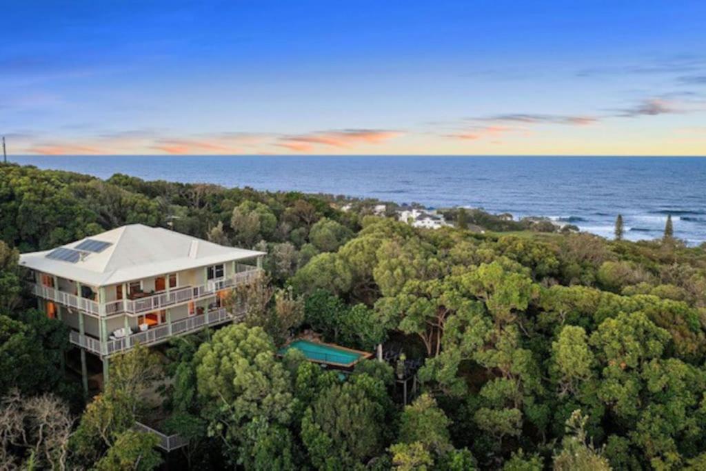 an aerial view of a house in the forest at Breathtaking Panoramic Ocean Views in Yaroomba