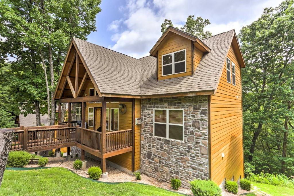 a home with a wrap around porch and a deck at Branson Home with Game Room, Near Silver Dollar City in Branson
