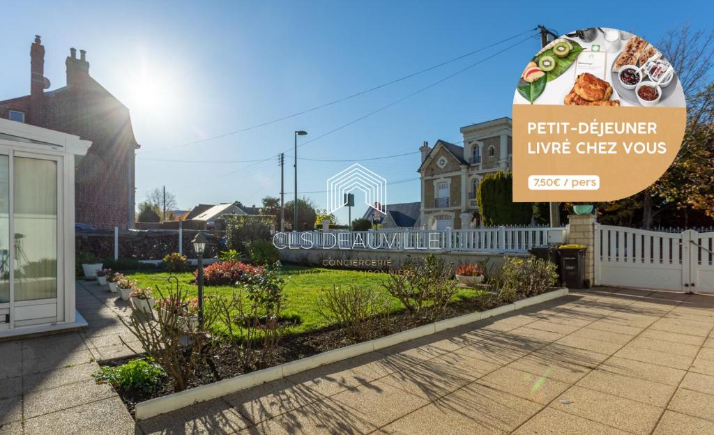 un panneau devant une maison avec jardin dans l'établissement La Plaisance C.L.S Deauville, à Touques