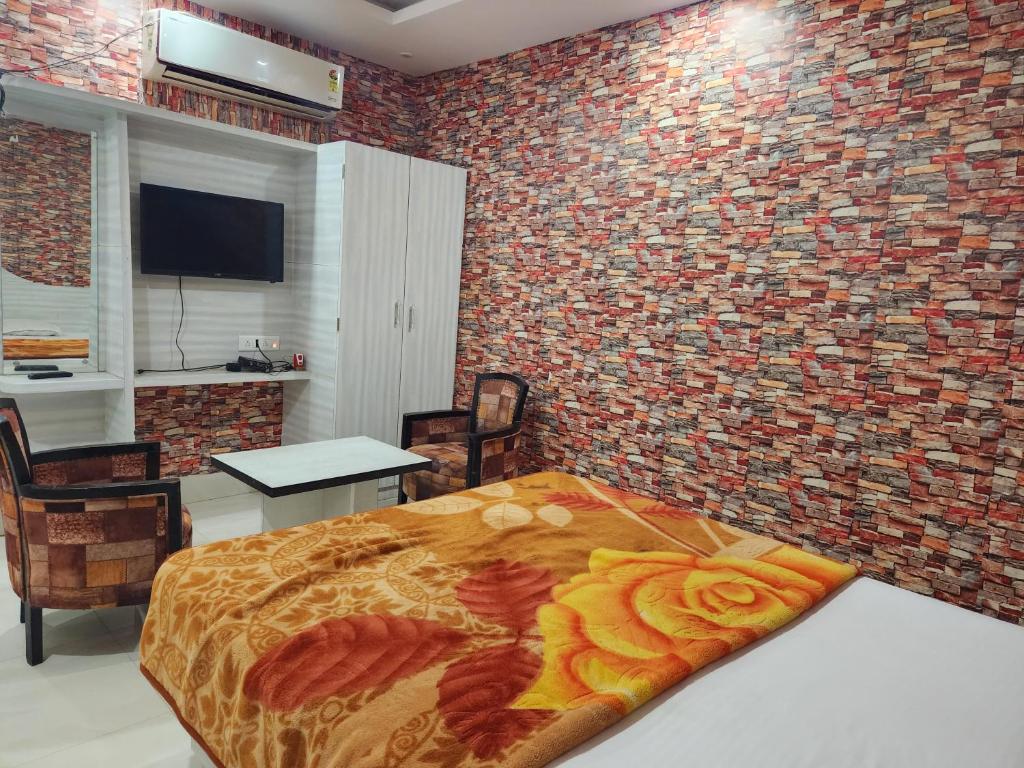 Postel nebo postele na pokoji v ubytování Golden Park Inn