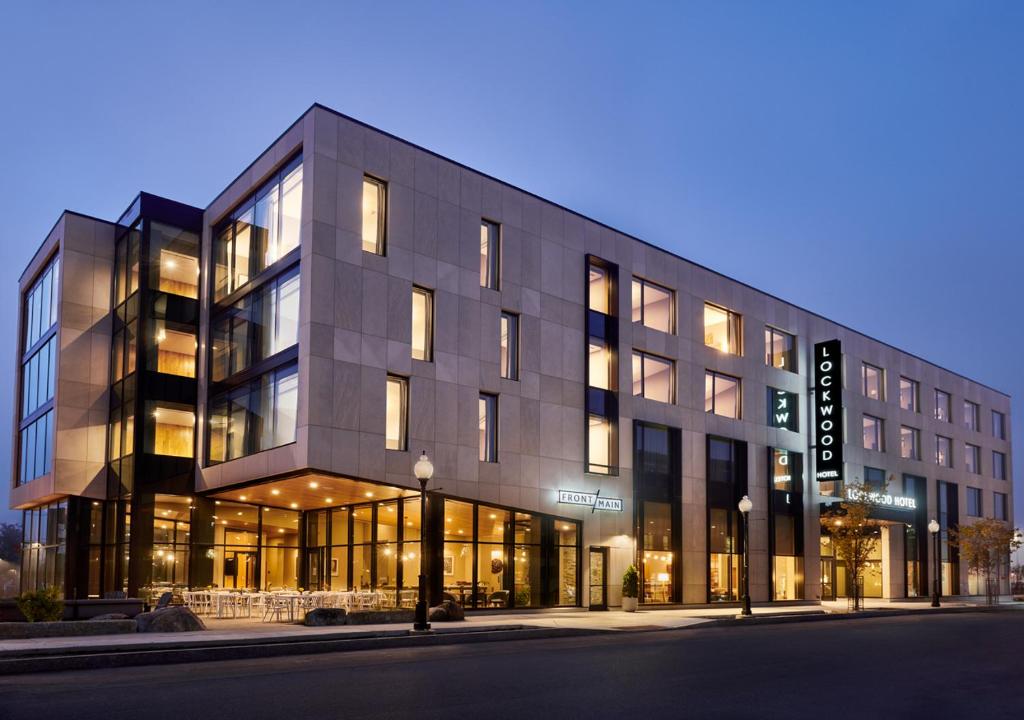 a building on a city street at night at Lockwood Hotel in Waterville