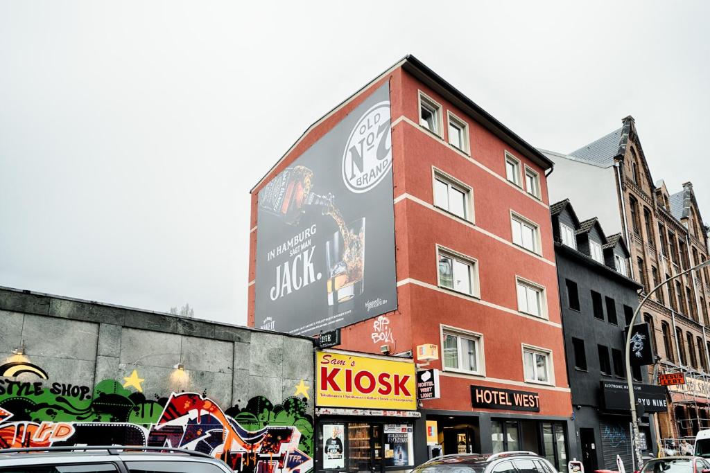 a building with a large sign on the side of it at Hostel Westlight in Hamburg