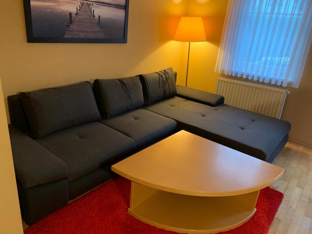 a living room with a couch and a coffee table at Ferienhaus Lutzmannsburg 2 mit direktem Thermenzugang und eigenem Garten in Lutzmannsburg