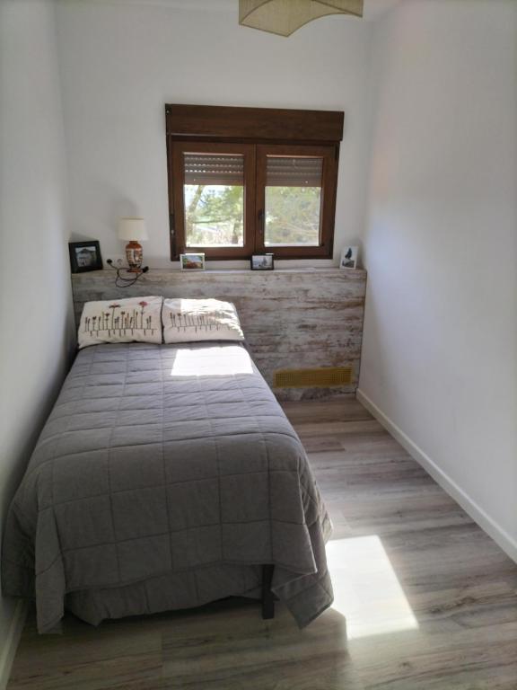 Posteľ alebo postele v izbe v ubytovaní Puerta Laguna - Casa con parcela