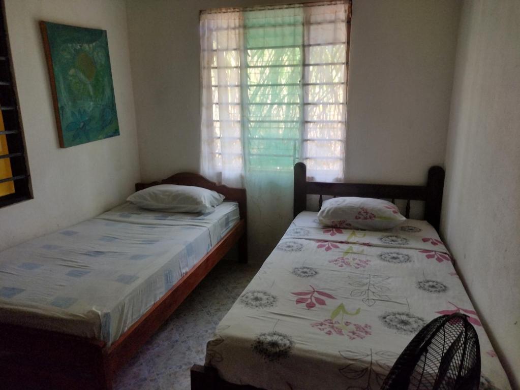 Postel nebo postele na pokoji v ubytování Cabinas del Mar