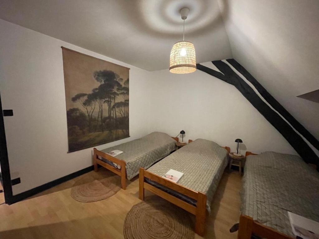 Posteľ alebo postele v izbe v ubytovaní Gite du vieux Morat