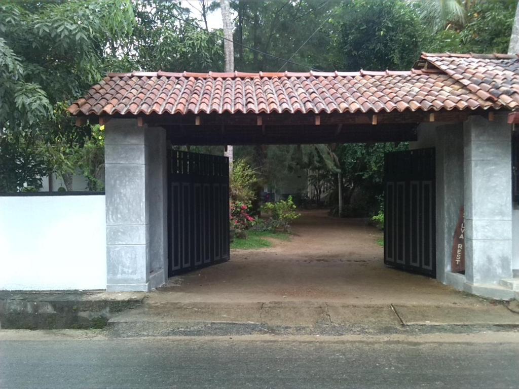 an entrance to a building with a gate and a roof at Silva Rest in Unawatuna