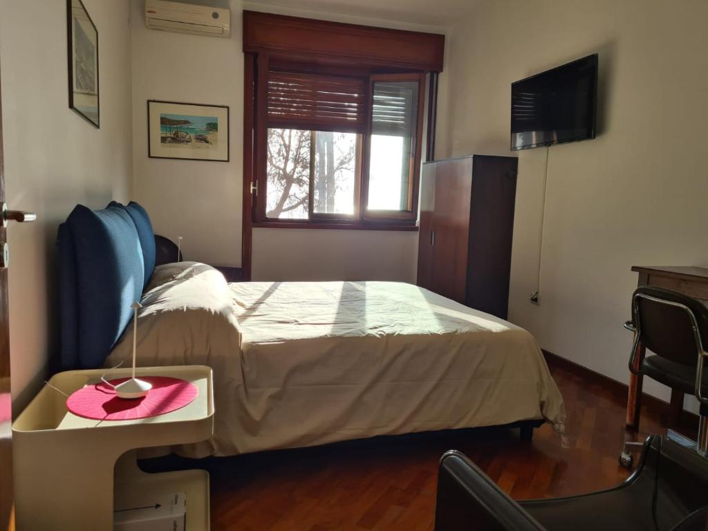 A bed or beds in a room at Casa D'Amato Salerno