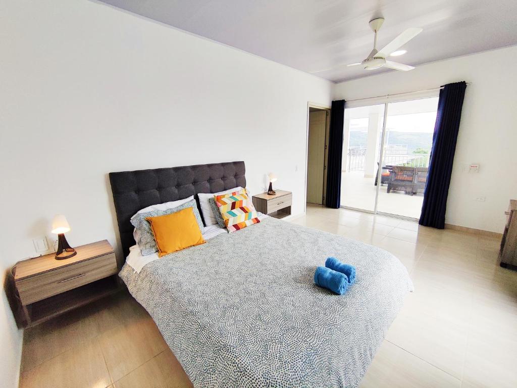 Postel nebo postele na pokoji v ubytování CasaMIA Hotel Boutique - Villeta