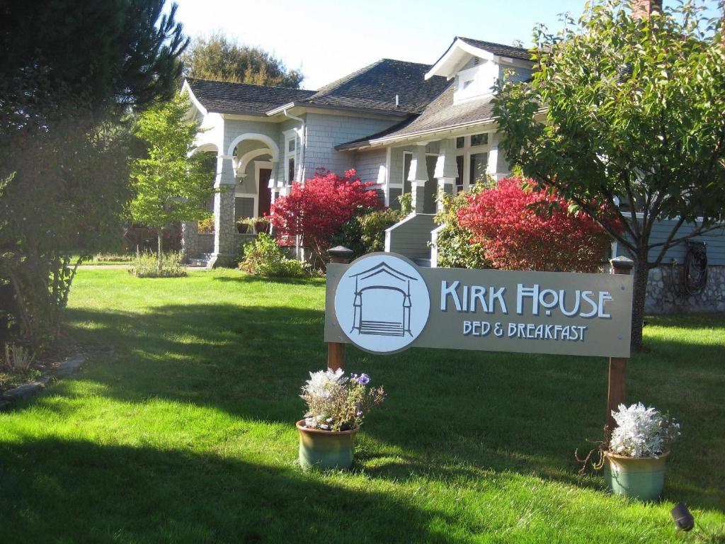 a house with a sign in front of a house at The KirkHouse Bed and Breakfast in Friday Harbor