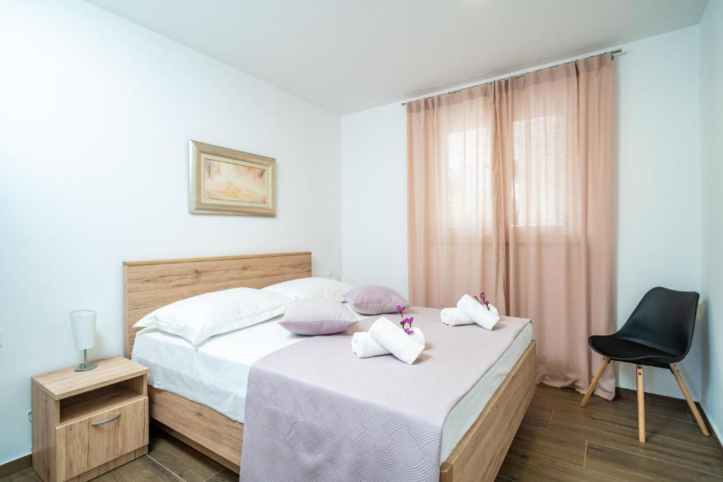 Posteľ alebo postele v izbe v ubytovaní Blue Bay Apartment