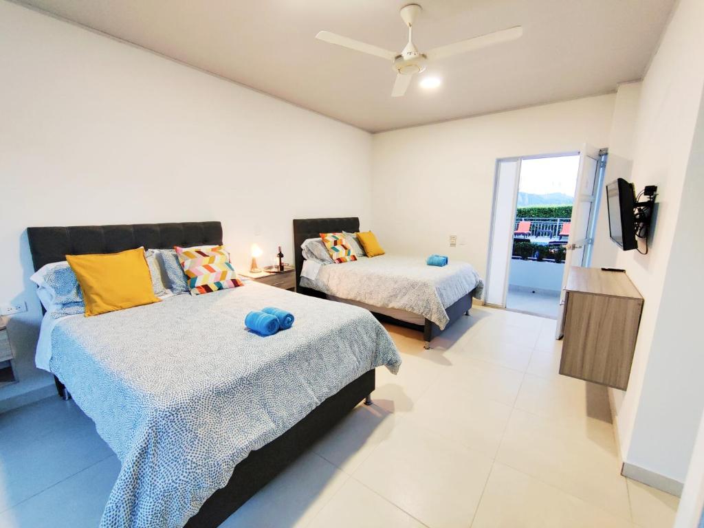 Postel nebo postele na pokoji v ubytování CasaMIA Hotel Boutique - Villeta