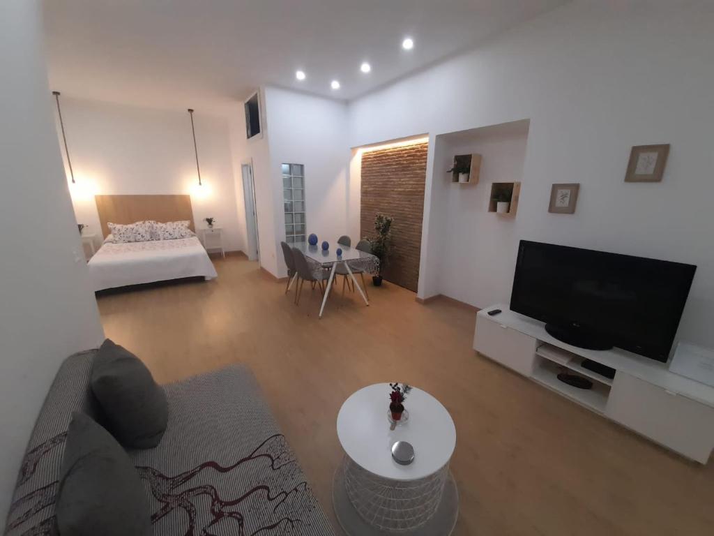 Televízia a/alebo spoločenská miestnosť v ubytovaní Apartamento Luna de Noviembre