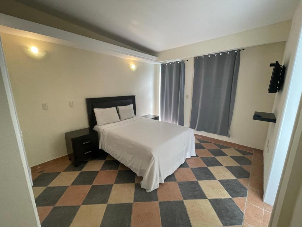 Postel nebo postele na pokoji v ubytování Hotel Real Home