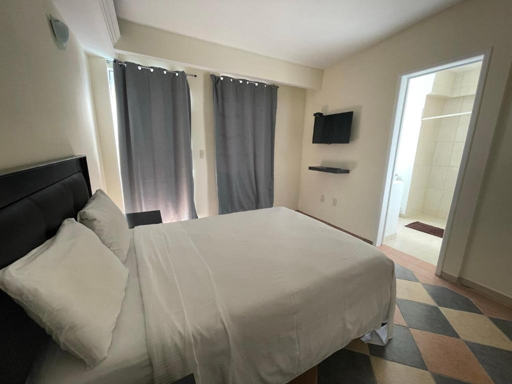 Postel nebo postele na pokoji v ubytování Hotel Real Home