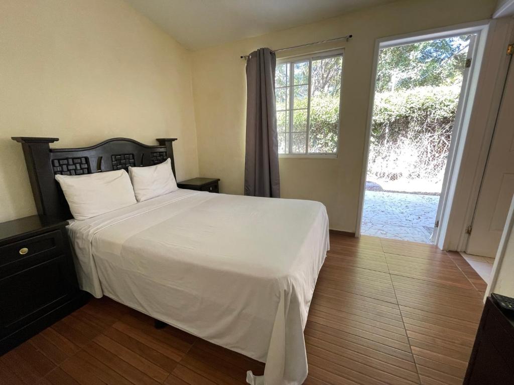 Postel nebo postele na pokoji v ubytování Hotel Real Home