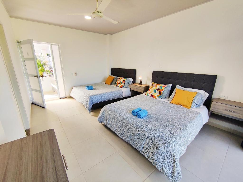 Postel nebo postele na pokoji v ubytování CasaMIA Hotel Boutique - Villeta