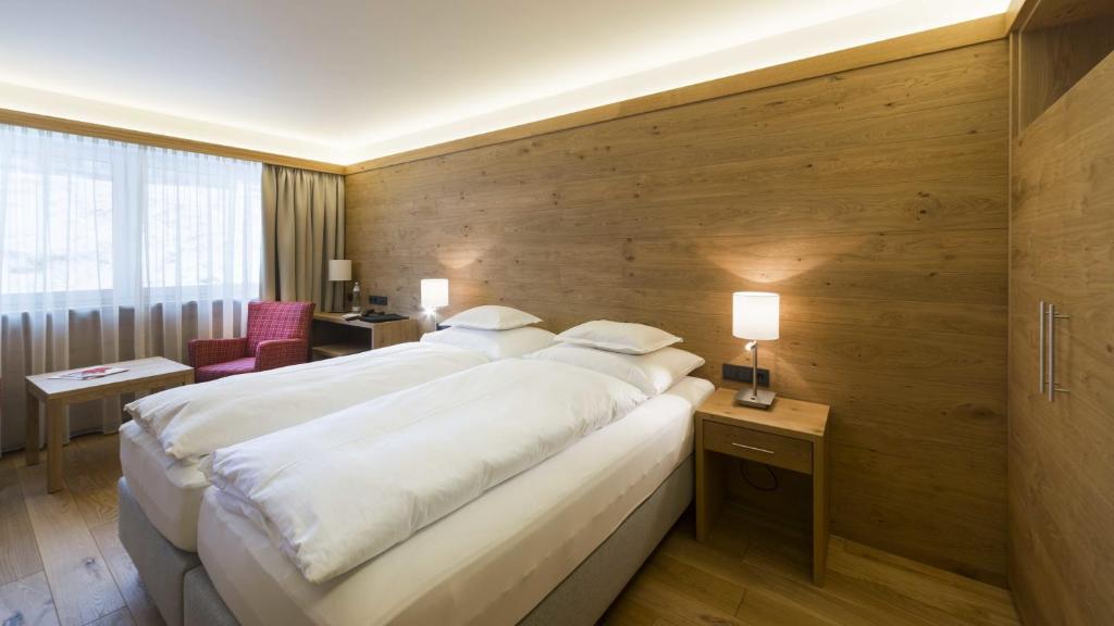 Postel nebo postele na pokoji v ubytování Hotel Garni Panorama