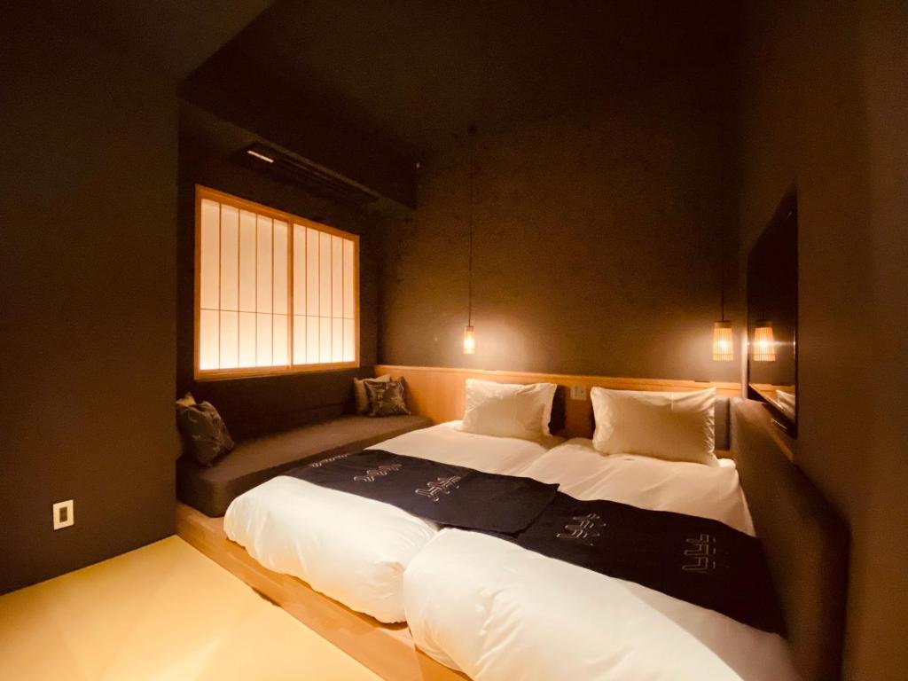 Postel nebo postele na pokoji v ubytování Hotel Zagakukan