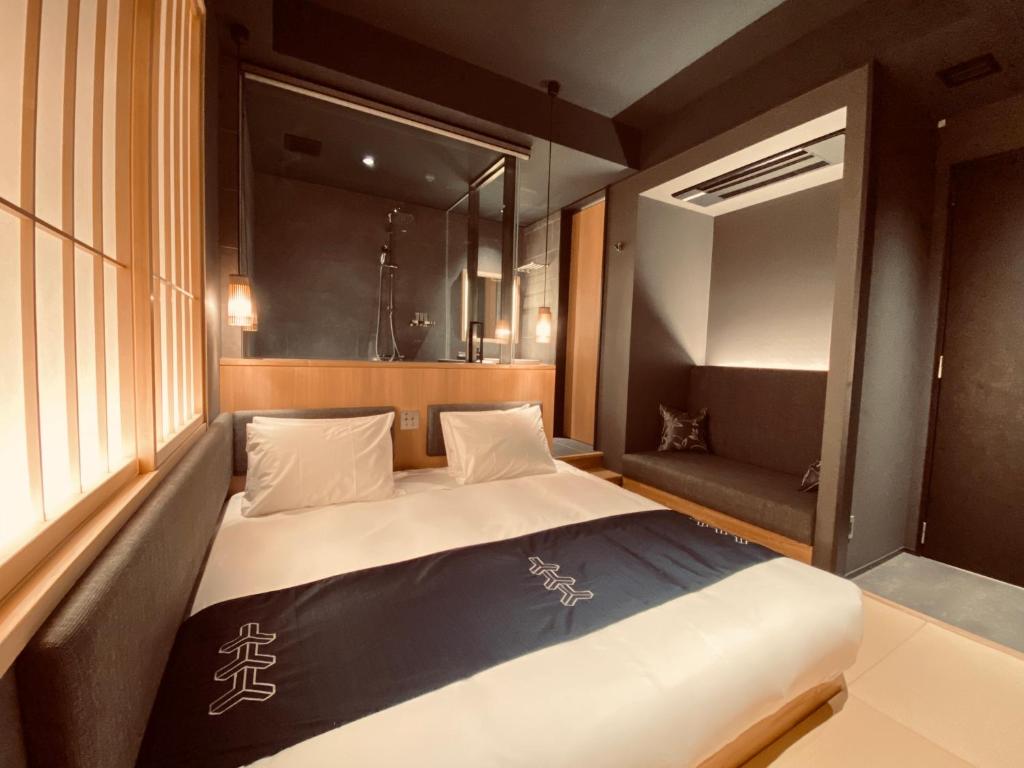 Postel nebo postele na pokoji v ubytování Hotel Zagakukan