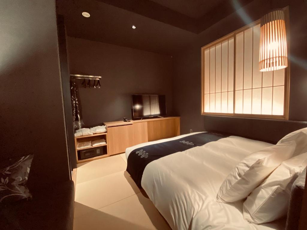 Postel nebo postele na pokoji v ubytování Hotel Zagakukan