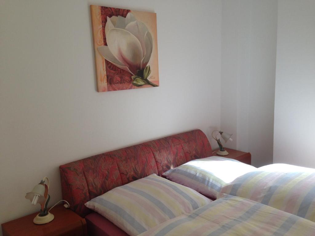 a bedroom with a bed and two lamps on tables at Apartment Nürnberg City-Center in Nuremberg