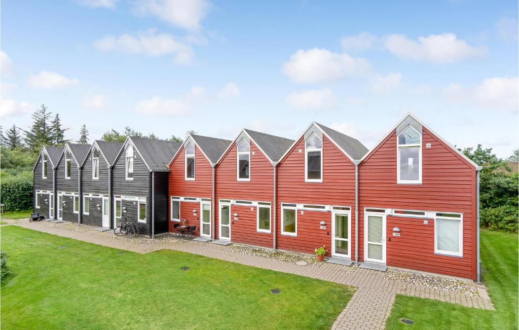 a row of houses with red at Lovely Home In Nrre Nebel With Wifi in Nørre Nebel