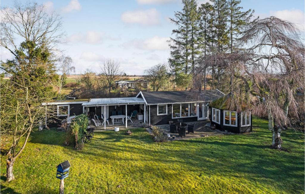 a house in the middle of a yard at Beautiful Home In Orø With Wifi in Orø