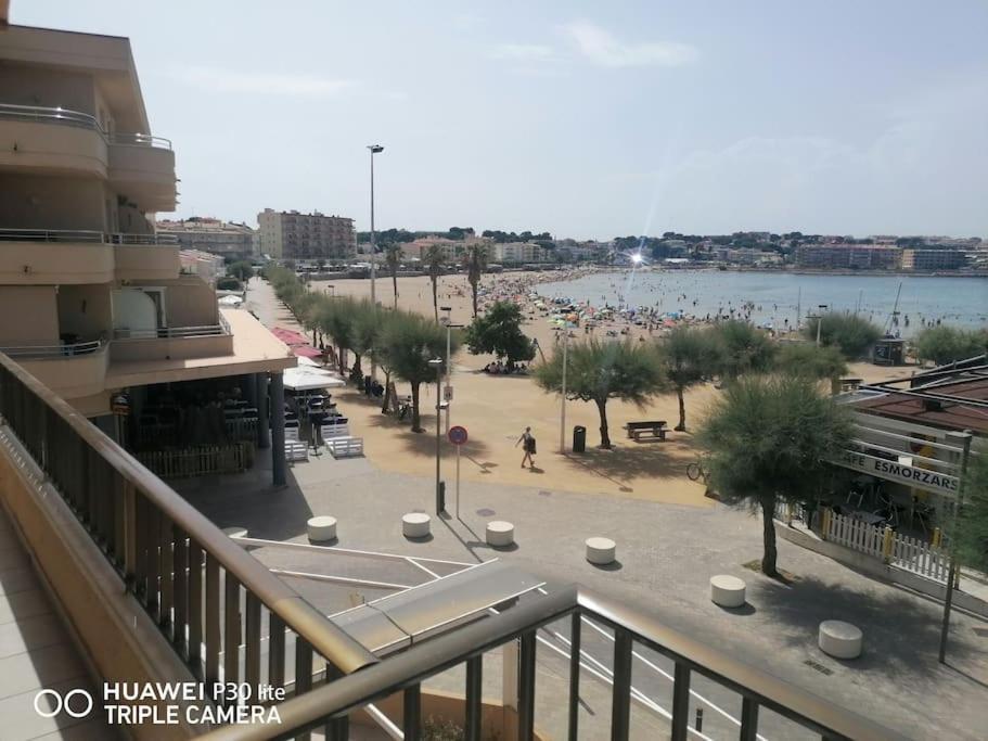 a view of a beach from a balcony of a building at Riells mar in L'Escala