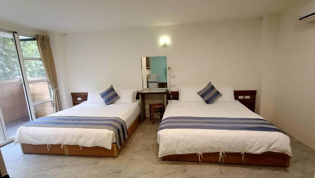 Postel nebo postele na pokoji v ubytování Xitou Tianpin Homestay