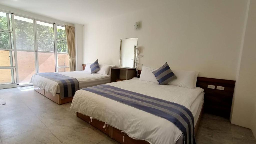 Postel nebo postele na pokoji v ubytování Xitou Tianpin Homestay