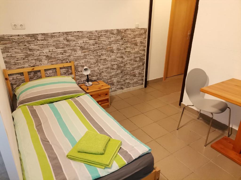 Uma cama ou camas num quarto em Pension Prem