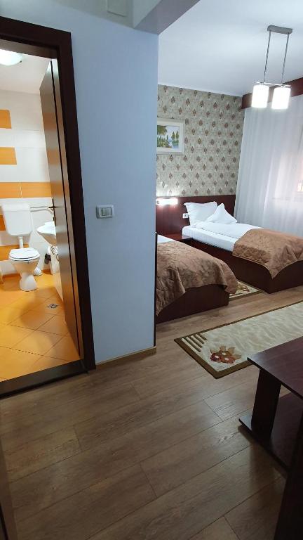 Postel nebo postele na pokoji v ubytování Pensiunea Select