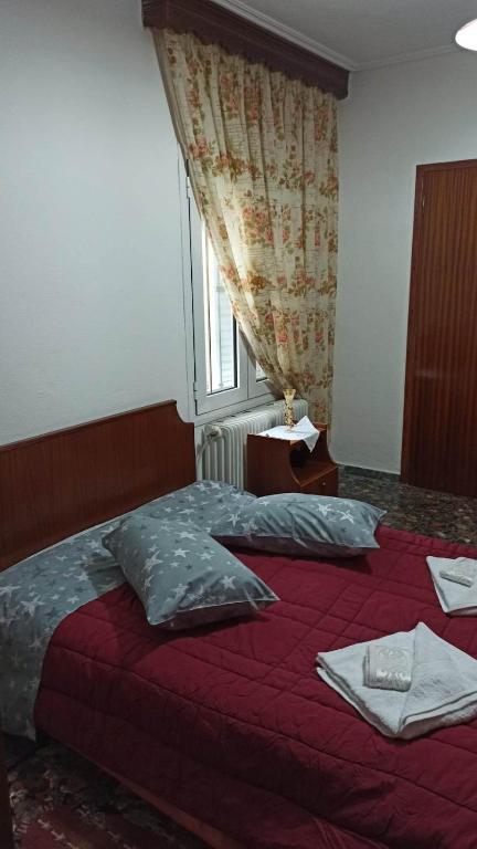 Postel nebo postele na pokoji v ubytování Panourgia's House