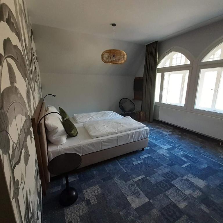 Postel nebo postele na pokoji v ubytování Wellnesshotel Waldquartier GmbH